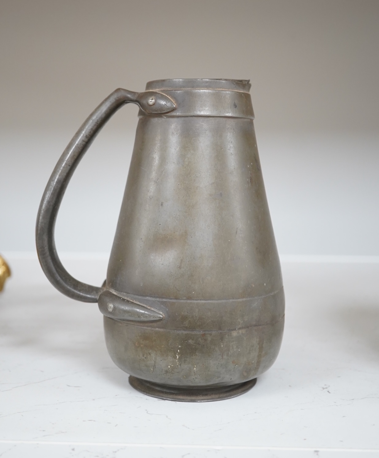 A Liberty Tudric pewter water jug, 17cm high. Condition - fair